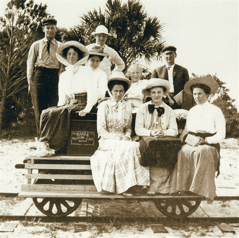 black and white photo of people riding the Town's railcar from the Atlantic to the lagoon