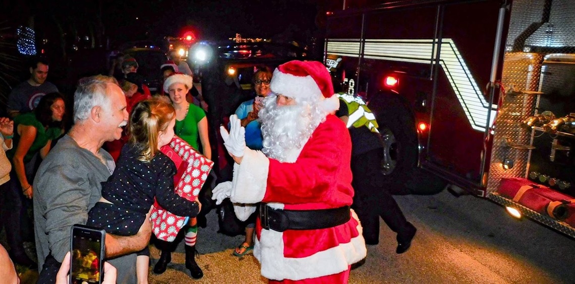 Santa delivering presents during the Santa Run